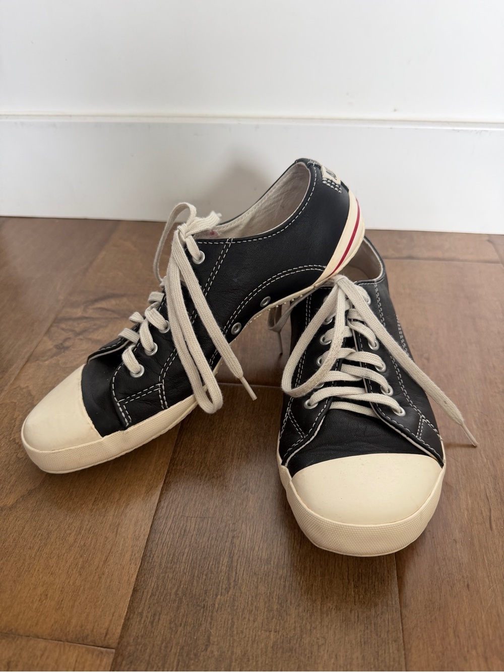 Black Low-Top Leather Converse with Cream Toe Caps